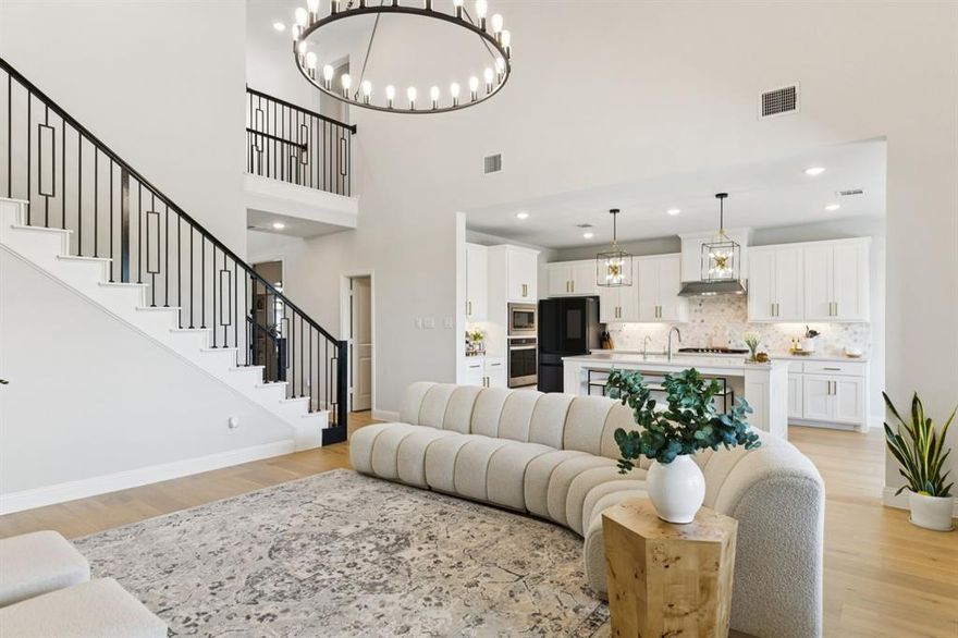 Beautifully maintained American Legend home located in the highly sought-after Union Park neighborhood. Built in 2023, this modern two-story home offers an ideal layout with upgrades throughout. The main floor features a spacious private office with soaring ceilings, an open-concept kitchen and dining area with a gas cooktop, stainless steel appliances, and a refrigerator that stays with the home. A large utility room with a mud bench off the garage, a half bath, and a serene primary suite complete the downstairs. The primary bedroom includes double vanities, a soaking tub, separate shower, and an oversized walk-in closet. Upstairs, you'll find two additional bedrooms, two full bathrooms, a game room, and a dedicated media room. In the backyard, you can enjoy the covered patio and fully equipped outdoor kitchen, all backing to a peaceful tree-lined greenbelt for added privacy. The washer and dryer can also stay. This home is in a great location, just minutes from HEB, Costco, and the Dallas North Tollway.