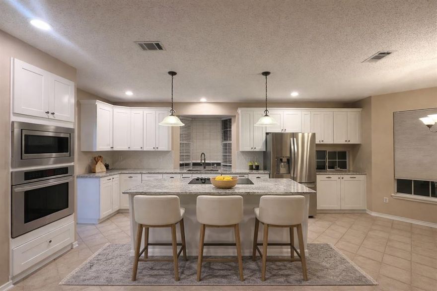 Located on a quiet cul-de-sac in Carrollton, this spacious two-story home offers 5 bedrooms, 3.5 baths, and a bright, open layout. The kitchen features granite countertops, J&K solid wood cabinetry with soft-close drawers, and generous storage, opening to a living room with a gas fireplace. The primary suite is on the main level with dual sinks, a jetted tub, and a walk-in closet. Upstairs includes four bedrooms and two updated baths with quartz sinks. Two oversized Trane AC units provide year-round comfort. Close to major highways, shopping, dining, K-Town, and top-rated and convenient proximity to I-35, Hwy 121, and George Bush Turnpike. Ready to welcome its next chapter and the family who will call it home.