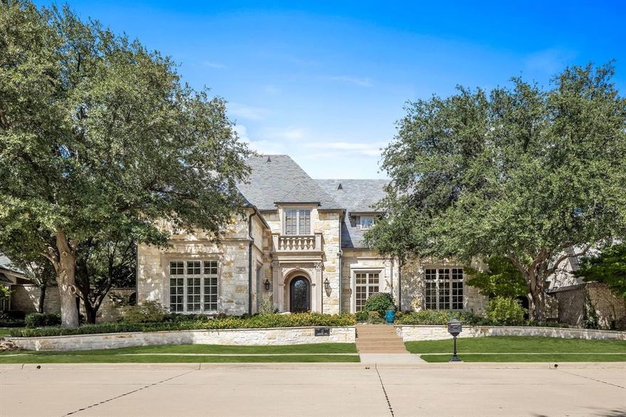 This stunning home in the prestigious Villages of Stonebriar in Frisco, TX, boasts cathedral vaulted ceilings with exposed wood beams, hardwood floors, and plantation shutters throughout. Arched doorways create an elegant flow from room to room, while Pella windows bring in abundant natural light. Kitchen has top of the line appliances, walk in pantry, granite island & counters, and pull-out gliding shelves. Cooks delight over an extra cooktop with vent in the laundry room. The home features a stone exterior with a Vermont slate roof and a floored attic. Bathrooms showcase luxurious granite and marble counters, floors, and showers. Two intricate cast-stone fireplaces add a touch of refinement. Outdoors, enjoy the beautiful living space with a mosquito system, fire pit, and electric heater on the covered patio, perfect for year-round comfort. Come see this meticulously appointed home!