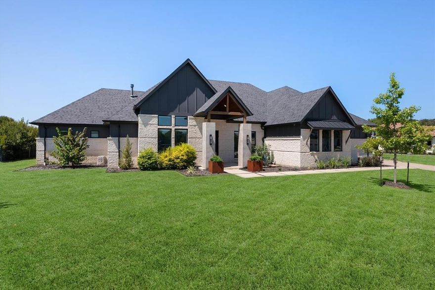 Welcome to an elegant home with a relaxed, welcoming feel in this beautifully functional, light and bright estate on .75 acres. Tucked quietly away on a cul-de-sac lot, this home is thoughtfully designed for comfortable living and entertaining alike, all on ONE spacious story. The pivot iron and glass front door welcomes you into a flowing home that meets your every wish. Beautiful white oak flooring throughout the living spaces and designer touches evokes a modern yet comfortable vibe.

The kitchen is perfect for making memories and meals, with sleek quartzite countertops, double convection ovens, a warming drawer, a 5-burner gas stove, and a built-in coffee system. A concealed walk-in pantry with room for an additional refrigerator and prep space is just around the corner.

The living room features a dramatic linear fireplace and a wall of windows with sliding doors that open to the outdoor living space, heated saltwater diving pool, and expansive backyard. Just around the corner, a large game room offers so much flexibility with walls of windows and additional sliders to the pool. A media room provides the perfect spot to escape with a movie or to cheer on your favorite teams.

Each of the four bedrooms has its own en-suite. The primary suite is a secluded sanctuary with a dream spa-like bathroom. The laundry room is stylish in itself and conveniently connects to the primary closet. 

Working from home will be a pleasure in the spacious, light filled dedicated office with floor to ceiling windows.

An oversized 3 and a half-car garage with epoxy floors includes a dedicated staircase leading to a spacious floored attic for safe and easy access. 
Among other energy efficiency and advanced technology features, a subsurface drip septic system and foam insulation help keep this home easily maintained and enjoyable year-round. 

Come and see everything that this gorgeous home has to offer!