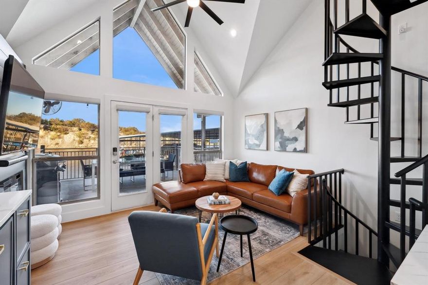 Stunning Lakefront Cabana on PK Lake – Sportsman’s World
Welcome to your dream getaway on Possum Kingdom Lake! This beautifully updated 2-bedroom, 2-bathroom condo in Sportsman’s World offers the perfect blend of modern comfort and lakefront charm. Whether you're looking for a weekend retreat or a full-time residence, this home has it all!
A boat slip is available for transfer from Bluff Creek Marina

Step inside to a stylish, open-concept living space featuring vaulted ceilings, a spiral staircase, and floor-to-ceiling windows that fill the home with natural light. The kitchen boasts custom cabinetry, stainless steel appliances, and quartz countertops, while the cozy living area leads out to a private balcony with stunning waterfront views—perfect for morning coffee or evening relaxation.

The primary bedroom features a plush king-size bed, while the second bedroom is ideal for guests or family, with bunk beds and additional sleeping space. Both bathrooms are updated with modern finishes to ensure comfort and convenience.

The Canyon's has a community pool.

As part of the Sportsman’s World community, you’ll have access to a variety of top-tier amenities, including:
Community Pool
Tennis courts & playground
Marina access & general store

Enjoy days spent boating, fishing, kayaking and soaking up the sun on PK Lake, then return to the tranquility of your private retreat. This is lake living at its finest!

Don’t miss this rare opportunity—schedule your private tour today! Short term rentals are not allowed for this condo.
Option to purchase fully furnished!