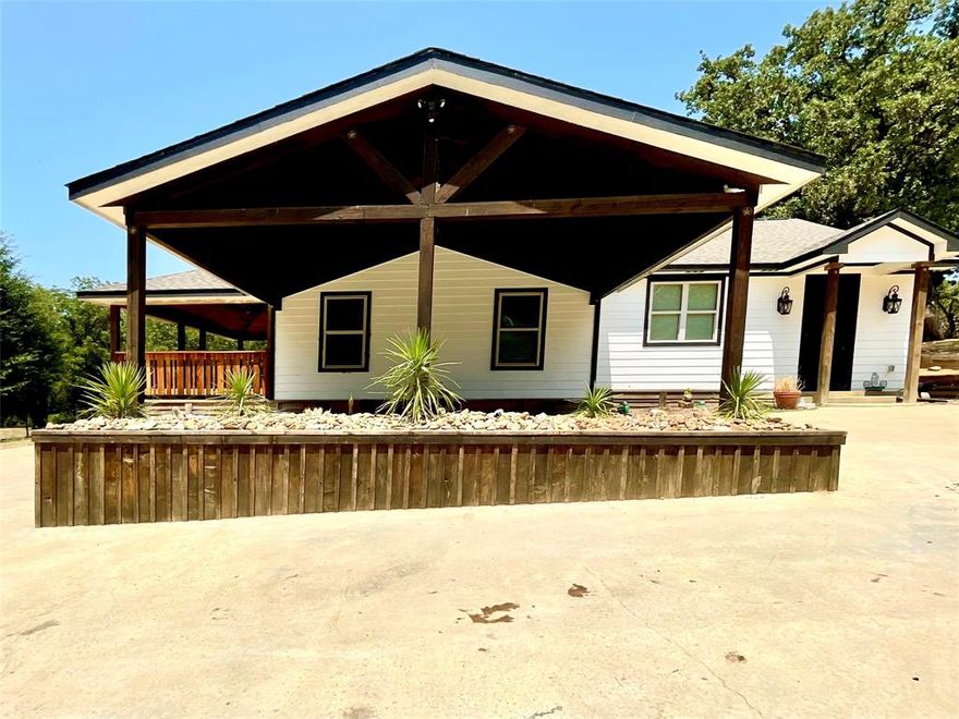 5 Acres Residence with space for animals and outdoor activities ! This property offers a completely updated residence with serene natural setting. The home underwent a total update in 2020.  It was expanded with 668 square feet of new construction built in 2020, It features 4 bedrooms and 2 rustic full bathrooms, with hardwood floors throughout. Living room provides spacious and functional layout that seamlessly flows to the dining area, while the kitchen boast granite counter-tops, gas stove and custom cabinets. It also features new roof, new HVAC, new windows and new electric system to ensure exceptional energy efficiency and security system .  Concrete driveway and porch also installed in 2020 enhance the curb appeal. Animal enthusiasts will appreciate the stables on the property, with individual stalls and concrete floors designed for the care of your horses. This home is perfect for those seeking country living!