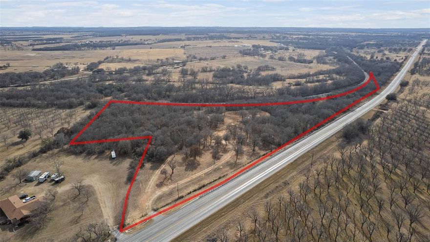 Wonderful 12 Acres that has 10 acres fenced and gated, land is freshly cleared and brush mulched. Well and Pump house in place. The Property has large trees throughout . Utilities are place and functional and ready if someone wants to build, install a mobile or manufactured home or a hunting cabin. There is an existing drive that circles the property at the entrance. This provides a prime location for building. No Restrictions and New Survey completed prior to the demolition and removal of the structures. There is a gate at the entrance of the property.