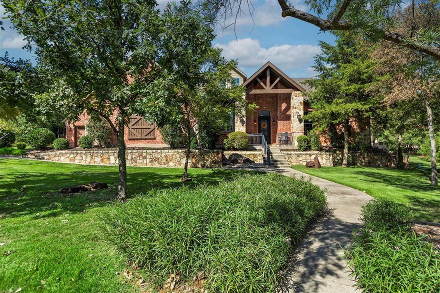 This custom-designed home rests on a private, treed one-acre lot in a quiet cul-de-sac within the exclusive Oak Shores neighborhood of Cross Roads. Built in 2013 and updated with a 2023 remodel, it offers over 3,800 square feet of thoughtfully planned living space. The main level features hardwood floors throughout the living area, kitchen, bedrooms, office, and half-bath, with tile in full baths and the utility room. A stone fireplace anchors the living room and opens to a well-appointed kitchen with custom cabinetry, island, breakfast bar, and walk-in pantry. Two dining areas provide flexibility, including one large enough for a substantial dining table with an adjoining seating area. The home office features picture-frame paneling, built-in shelving, and lower cabinetry, creating a warm and efficient workspace. The primary suite offers privacy and comfort with an 11-foot tray ceiling, plantation shutters, and an ensuite bath with dual vanities and walk-in closet. Upstairs, a spacious bonus room includes a full bath and large walk-in closet, along with a substantial floored and insulated storage room. The property also features two garages with enclosed parking for three vehicles. Mature shade trees surround the home, enhancing its private and peaceful setting. Outdoor living is elevated by a covered flagstone patio with vaulted beadboard ceiling, complemented by additional patio areas overlooking a fenced backyard, ideal for pets and secure enjoyment. The home and irrigation system are serviced by a private water well, with community water available along Oak View Ct. Oak Shores is a lakeside community along Lake Lewisville, south of Us380, between Denton & Frisco. Known for its upscale homes on treed acre lots & neighborhood park, the community offers a quiet rural environment with the added benefit of no city taxes, while remaining convenient to shopping, dining, hospitals, airports, and the business and entertainment corridors of Frisco, Plano, & North Dallas.