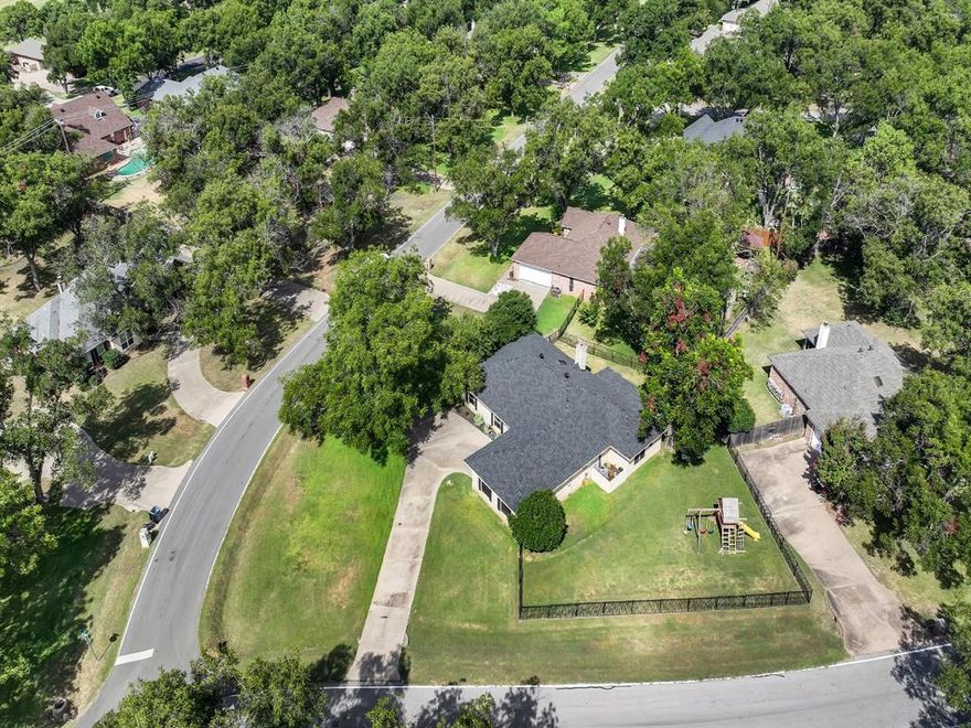 Welcome to 6103 Prospect Hill Drive, a beautifully maintained corner-lot home tucked inside the sought-after Pecan Plantation community. This amenity-rich, gated and guarded neighborhood truly has it all—multiple pools, parks, a marina, tennis, restaurants, golf courses, and so much more. Conveniently located near the back gate and club, this home offers both privacy and easy access to everything the community has to offer.

Step inside and you’ll immediately notice the abundance of natural light that fills the home, highlighting the open and inviting layout. The spacious living room features soaring ceilings and a stunning stone wood-burning fireplace that creates a cozy yet impressive focal point. Just off the living area, you’ll find a wet bar that makes entertaining family and friends effortless.

The home offers three generously sized bedrooms and three full bathrooms, providing plenty of space for everyone. There’s also a versatile bonus room that can easily serve as a home office, workout room, playroom, or hobby space. Every detail has been thoughtfully designed to balance comfort and functionality.

Outside, the fenced yard is perfect for pets or play, and the extended concrete patio (added in 2024) provides a wonderful spot for outdoor gatherings or quiet evenings under the stars. A huge circular driveway not only adds to the curb appeal but also makes parking and hosting guests simple and convenient.

This property has been beautifully updated with all the big-ticket items already taken care of: new roof (2024), new HVAC (2024), farmhouse sink (2025), remodeled primary bathtub (2024), new floors (2023), and new windows in the living areas and secondary bedrooms (2024). These thoughtful upgrades mean peace of mind for years to come.

If you’ve been dreaming of a move-in ready home where modern updates meet small-town charm and resort-style living, this one checks all the boxes. 6103 Prospect Hill Drive is more than a house—it’s a lifestyle.