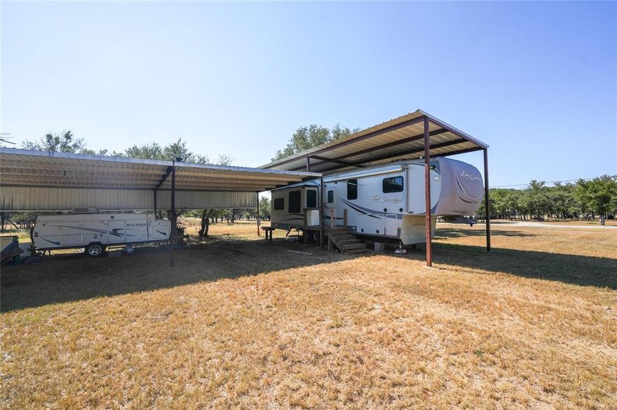 Welcome to your perfect lake retreat in May, Texas, located in the highly desirable Harbor Point Owners Association on beautiful Lake Brownwood. This property comes fully equipped for both full-time living or weekend getaways. The site also offers perfect building sites for your next home. The asking price includes a spacious 40-foot 5th wheel carport as well as a well-maintained Heartland Big Country 5th wheel RV, offering the comfort and convenience of home with the flexibility of lake life. In addition, a large 40x20 carport is included, providing ample space for covered storage, whether for vehicles, boats, outdoor equipment, or additional recreational needs. With water, electric, and septic already installed on site, everything you need is in place for an easy transition to your new lake lifestyle. The Harbor Point Owners Association provides a welcoming community atmosphere with an excellent variety of amenities designed for relaxation and recreation. Residents enjoy access to a private boat ramp for quick and easy entry to Lake Brownwood, making boating, fishing, and water sports just minutes from your doorstep. The community also features a boat dock, boat ramp, swimming pool for gatherings and fun with family and friends, as well as picnic areas and recreational spaces where you can relax and unwind under the Texas sky. Beyond the community, the property is only a short drive from Brownwood, Texas, where you’ll find a wide variety of shopping, dining, entertainment, schools, and medical facilities. Whether you’re looking for a permanent residence, a vacation spot, or even to make this property your home, it has all the possibilities.