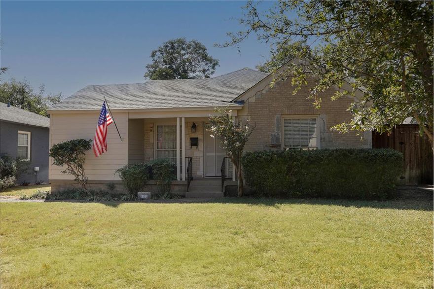 Charming cottage with covered front porch nestled in sought-after Briarwood neighborhood, steps away from top restaurants and neighborhood shops. Custom window coverings, designer lighting & original hardwood floors throughout, fresh hardware and paint. Large living room is anchored by a wood-burning fireplace and multiple windows. Original curved archway leads to formal dining area. Updated kitchen with stainless steel appliances included, built-in storage, glass-front cabinets, and granite countertops. Large Primary bedroom with ensuite bathroom that has been fully updated with white marble vanity with dual sinks, oversized seamless-glass shower, and walk-in closet with separate full-size utility area with Washer & Dryer included. Spacious secondary bedroom features custom window treatments and two separate closets. Full bathroom located off of the hallway with hallmark wainscoting, tub-shower, fun tile, and built-in storage. Large, lush backyard with tall privacy fence and designated patio area – perfect for outdoor entertaining! Walk to  nearby eateries including José, Drake’s Hollywood, Seafood on Lovers and Celebration. Centrally located, with an eight-minute drive to Love Field Airport and JSX Private Terminal.