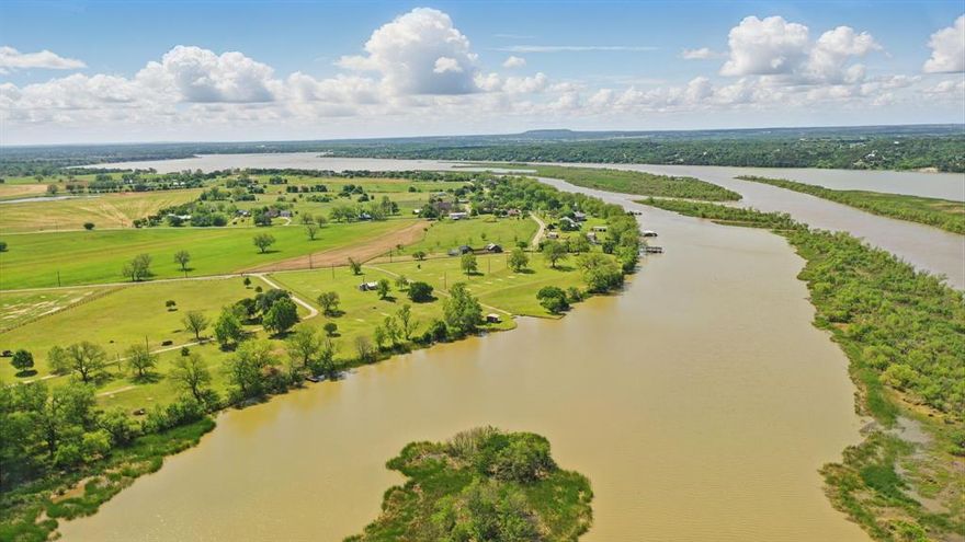 Located just north of the charming and historic town of Granbury, Texas, this extraordinary 53.739-acre property offers the perfect blend of natural beauty and recreational opportunities. With over 1,665 feet of pristine Brazos River frontage, this unique parcel features stunning views, abundant wildlife, and a variety of amenities for outdoor enthusiasts and investors alike. Whether you're seeking a private retreat, a place to build your dream home, or an investment opportunity, this riverfront property offers it all. With an abundance of wildlife, the property is perfect for hunting, fishing, or simply enjoying the natural splendor. Don’t miss the chance to own a piece of Texas paradise! Riverfront Access: Enjoy expansive river frontage with direct access to the Brazos River. A private boat ramp allows for easy launches, perfect for fishing, boating, or simply soaking in the serene waters.Spacious Workshops & Storage: A 12x20 boat shop and a large 40x60 workshop provide ample space for storage, projects, and equipment.RV & Recreational Sites: With 32 RV spots, this property has potential for RV park development or simply for accommodating guests and family on their visits.ature & Views: Towering live oak trees provide shade and natural beauty throughout the property, enhancing the serene atmosphere. Several elevated spots offer incredible views of the river and surrounding landscape.Water Wells: Two water wells are on the property, with one producing 40 GPM to ensure a reliable water supply for all your needs. Minerals do not convey.