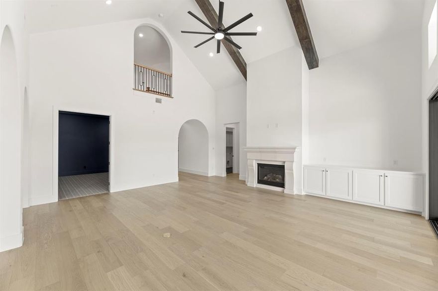 MLS# 21199776 - Built by Tradition Homes - Ready Now! ~ This expansive two-story home offers six bedrooms and six-and-a-half baths, introduced by a double door entry and an elegant curved staircase. At the heart of the layout, the great room flows seamlessly into the kitchen and hearth room, complemented by a functional prep kitchen. Sliding glass doors open to the extended covered outdoor living, establishing a refined indoor-outdoor connection ideal for entertaining. The private owner’s suite features a bay window and spa-inspired bath, while a dedicated study and versatile flex room enhance the main level. Upstairs, a spacious gameroom and secondary bedrooms provide comfortable separation and flexibility throughout. A four-car garage completes this thoughtfully designed home on one of the largest lots in this section of Mustang Lakes.  HIGHLY ACCLAIMED Prosper ISD