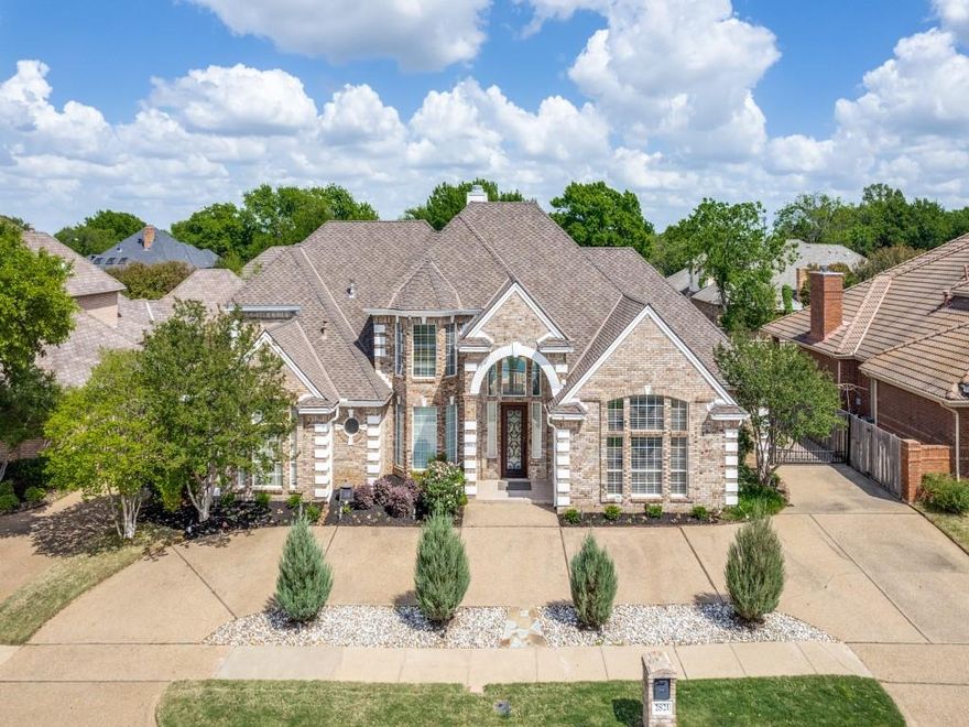 Location! Location! Location! Exclusive Forest Hills subdivision minutes from AT&T Stadium, Globe Life Field & DFW Airport. Conveniently located to Downtown Dallas and Fort Worth. Fabulous custom built four bedroom, 3 full bath home with approximately 3,709 sq. ft. Impressive entry with souring crossed beamed ceilings in living room with fireplace, wine bar, built-ins and views of the oasis in the backyard. Spacious kitchen includes custom cabinets, granite counters, pantry and is open to the breakfast dining room. Formal dining room. Large office-study with built-ins. Enormous primary bedroom with gas fireplace, custom built-ins, ensuite bathroom with dual vanities, separate shower, soaking tub and large walk-in closet with built-in cabinetry. Generously sized second bedrooms. Second bedroom downstairs with walk-in closet. Two bedrooms upstairs with Jack and Jill bathroom, dual vanities and plenty of closet space. Bedroom three has balcony with views of the backyard. Private fenced backyard area features covered and open patio area, pool-spa with plenty of space for your outdoor grilling needs. Community tennis, pickle ball, basketball courts, pavilion, pond and dog park. Close to schools, shopping and highways! A must see!!!