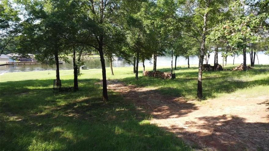 Lot 24 Sycamore, Yantis, TX

Discover the tranquility of lakeside living with this remarkable property located in the Royal Oak subdivision. Nestled on Lake Fork, famed for bass fishing, this lot at Lot 24 Sycamore in Yantis, TX offers a perfect blend of natural beauty and modern convenience.

With a sturdy sea wall and uninterrupted lake views, it's ideal for a weekend retreat, retirement haven, or angler's paradise. The lush, manicured lawn ensures a serene environment, ready for you to build your dream home.

Key Features
Direct access to Lake Fork.
Protective sea wall installed.
Scenic views in a peaceful setting.
Whether you're a fisherman, retiree, or family seeking escape, this property's location adds to its charm, offering both seclusion and community access. Yantis provides a quaint, welcoming atmosphere.

Target Audience
Fishermen near prime fishing.
Families for weekend retreats.
Retirees envisioning their dream home.
This scenic lot with overhanging trees offers postcard-worthy sunsets daily. With essential elements for your vision, building here promises harmony with nature and community life.

Marketing Insight
This is a rare find, blending natural beauty with key infrastructure like its sea wall. It's a durable foundation in a locale known for outdoor activities and community events.

Ready to explore Lot 24 Sycamore's potential? Contact Chris Knox to integrate this opportunity into your future plans.
Lot 25, 26, 27 are owned by the same family and there is a possibility to buy all of them. 
Minimum 2500 sq ft, no manufactured homes. Buyer and buyer's agent to verify all information.