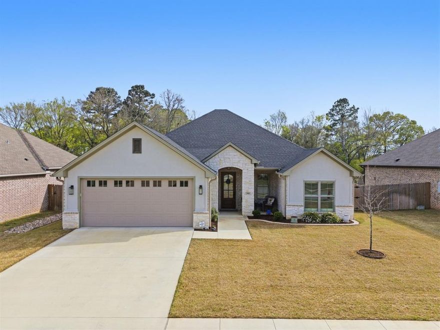 Tucked into a quiet neighborhood in Chandler, this 2022-built home offers the kind of space, light, and layout that just feels right the moment you walk in! With 3 bedrooms, 2 bathrooms, and 2,200 sq ft, it’s thoughtfully designed for both everyday living and easy entertaining. The main living area is bright, open, and filled with natural light, featuring a vaulted ceiling and a sleek fireplace flanked by custom built-ins. French doors lead out to the backyard while large windows frame peaceful views of the spacious yard and wooded backdrop beyond. The kitchen flows seamlessly from the living and dining areas, featuring granite countertops, stainless steel appliances, a large center island with bar seating, and abundant cabinetry for storage. Thoughtful upgrades like under-cabinet lighting, a generous walk-in pantry, and upgraded appliances since the home was built make the space as functional as it is beautiful. Throughout the home, upgraded window shades and plantation shutters offer both privacy and energy efficiency. The primary suite is a true retreat, complete with elevated ceilings and a spacious ensuite bath offering dual vanities, a soaking tub, walk-in shower, and separate his-and-her closets. Out back, you’ll find a large, fully fenced yard and covered patio - plus a storage building for all the extras! Additional features include a 2-car garage with extra depth and overhead storage, a spacious utility room with built-in cabinetry, sprinkler system, gutters, and energy-efficient upgrades for low-maintenance living. Conveniently located near Lake Palestine, shopping, and schools, and within walking distance to Winchester Park with a disc golf course, baseball fields, playground, and fishing pond. Clean, bright, and move-in ready - schedule your showing today!