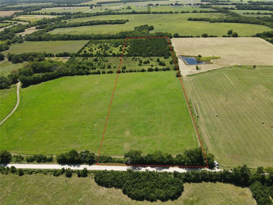 Hard to find small acreage tract just off Hwy 121. This offering is for 13 acres to be surveyed out of a larger 25+ acre tract. Water line has been upgraded and work has been completed to allow for one water meter for the 13 acres. Located on a low traffic county road this property will be the perfect place for your dream home. Enjoy the peace and tranquility of being out of town all while being minutes away from the conveniences city life offers. The front half is currently being used for hay production while the back portion is perfect for wildlife or livestock.