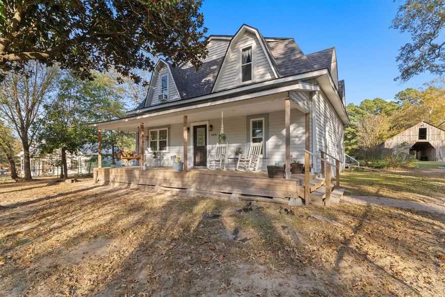 Step into East Texas history with this one-of-a-kind 1908 farmhouse, offering over 2,600 sq. ft. of character, comfort, and wide-open space. Set on two beautiful acres with partial tree coverage and a creek near the back of the property, this 2-story gem blends thoughtful modern updates from the last few years (roof, windows and upstairs central AC system) with the original heart of the home still shining through. Inside, you’ll find a surprisingly spacious layout featuring 5 bedrooms, 2 bathrooms and an upstairs flex space, with the primary suite conveniently located downstairs. The living room is cozy and inviting, filled with natural light, and the large kitchen and dining area make hosting easy, complete with an eat-in bar, plenty of room to gather, and all the charm you’d expect from a 1908 build lovingly cared for over the years. Step outside and enjoy the peace of country living from the covered front and back porches, perfect for morning coffee or unwinding at the end of the day. The property also includes a metal workshop (or detached garage), an incredible (and original!) wooden barn, an above-ground pool, and a hot tub - your own little getaway without ever leaving home. If you’re looking for a home with soul, space, and something truly unique while also being conveniently located near town, this is the one!