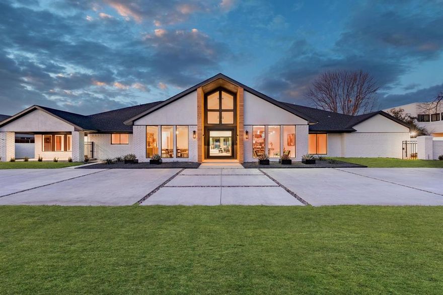 Modern reimagined estate in Preston Hollow on almost half an acre in the private school corridor. Fully remodeled into a minimalist entertainer’s paradise. All on 1 level, this sprawling estate offers 6.5 baths with a dedicated pool bathroom, 5 bedrooms, a gym-flex space, office, formal dining that seamlessly flows to a main living space, kitchen & bar. Two laundry rooms, 1 off the 3 car epoxied garage & 1 in the primary suite. Two bedrooms have private patios with courtyard. The pool has been completely redone with a waterfall edge spa. Thoughtful touches like the 16ft. of folding Prestige steel doors offer resort style indoor-outdoor flow. Incredible opportunity to have the best of functionality and elegance.