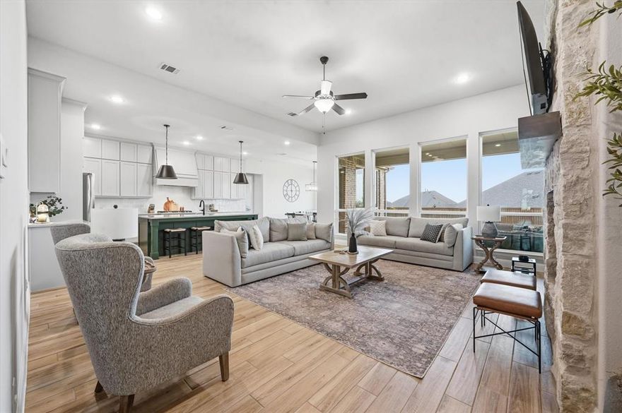 Situated on an oversized 80ft premium lot tucked into a quiet cul-de-sac and just moments from the Hilltop Club, this 2023 American Legend home brings together thoughtful design, high end upgrades, and a layout that actually makes sense for how people live. From the moment you walk in, the tall ceilings and natural light set the tone, with a private office at the front of the home framed by plantation shutters, giving you a clean, polished workspace without sacrificing privacy. The main living area opens up effortlessly, anchored by a spacious kitchen with a massive island, upgraded finishes, and a large walk-in pantry that keeps everything tucked away but within reach. The flow into the living and dining spaces makes it feel open without losing definition, ideal for both everyday living and hosting. The primary suite is exactly what you want it to be, spacious, quiet, and positioned for privacy, while the additional mother in law suite or second primary with its own ensuite bath gives you flexibility for guests, multigenerational living, or that perfect long term setup. The secondary bedrooms are thoughtfully connected by a jack and jill bathroom, creating a functional layout that works well for family or guests. A dedicated media room adds another layer, ready for movie nights, game days, or just a space to unwind. With over $85K in builder upgrades (full list available), every detail has been elevated beyond the standard build. Step outside to a covered patio overlooking a large backyard that actually gives you room to breathe, something you just don’t get on most 80ft lots. Located in highly rated Northwest ISD, just minutes from a plethora of restaurants, shopping, and retail, and finished with a 3 car garage, this is the kind of home that checks boxes you didn’t even know you had.