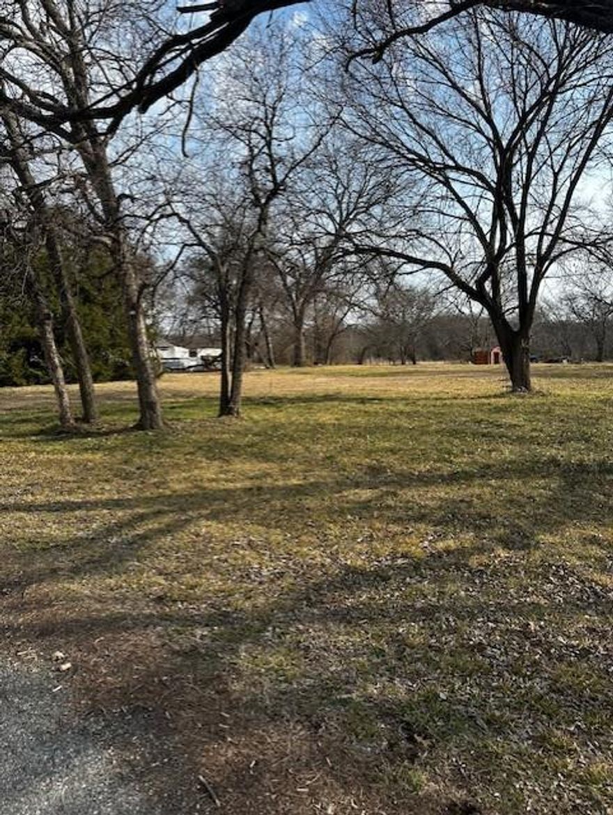 Located within the city limits of Bells, this lot joins two other lots being offered for sale by the same owner.  You can view those lots as listed on MLS numbers 21177941 and 21177957.  At one time this lot had a house on it which has since been bulldozed down and the lot cleared. This lot together with the other two lots being offered would give lots of room to build a house and a shop building, leaving plenty of room for your outdoor activities.  It is located near Roger Sanders Park. It is believed that City water and sewer is available. A sewer tap is believed to be on Jernigan Street side of the property.  The water meter has not been located at time of listing, but city water runs in front of the property. All information is deemed accurate but should be verified with the City of Bells for accuracy by buyer and buyer's agent.