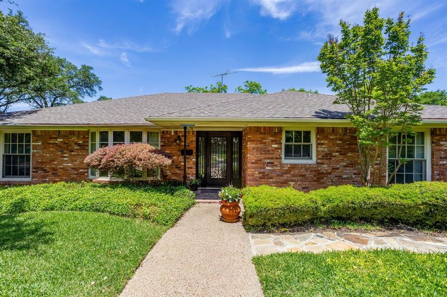Rare opportunity to own a classic home on one of Fort Worth's most sought-after streets in the Ridgmar Addition. Sitting on a generous lot shaded by mature trees and lush grass, this 3-bedroom, 2-bathroom home offers 2,467 square feet of timeless character just waiting for a new owner's personal vision. Rich hardwood floors flow through the main living areas, anchored by a warm wood-burning brick fireplace in the living room.  Entertain effortlessly with both a formal living room and a dedicated formal dining room, while everyday mornings are made easy with a sunny breakfast area and a built-in desk in the kitchen, perfect for staying organized. The unique sunroom adds versatile bonus space — ideal as a reading nook, home office, or plant-filled retreat. Outside, the expansive lot and mature trees create a private, park-like setting that's hard to find at any price point. Homes on Juneau Road don't come along often — schedule your showing today.