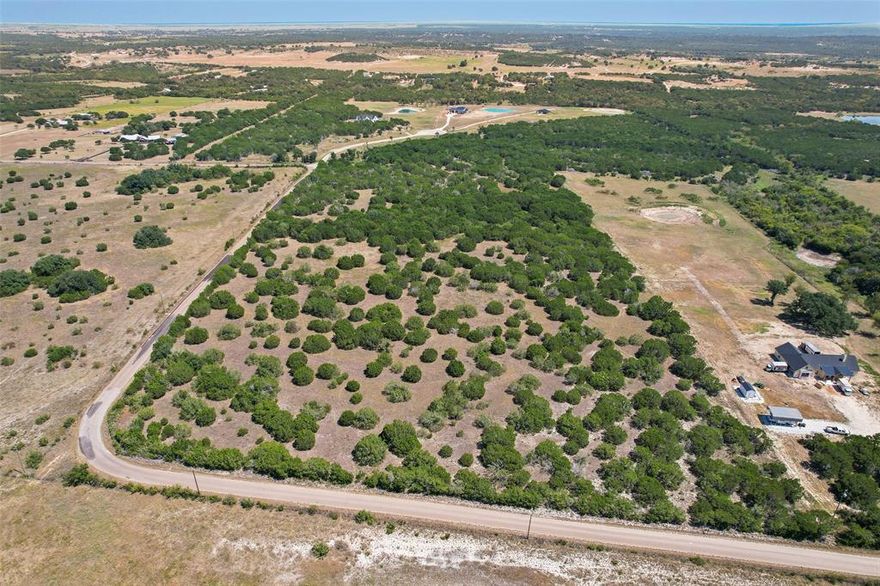 **BACK ON MARKET due to buyer financing** Come build your dream home on this gorgeous and highly private 11 acres overlooking the Brazos River Valley. Nestled on a corner lot with over 1600 sq ft of frontage road, and unmatched views. Current deed restrictions allow for livestock and bandominiums, while still preserving property values. Outside of the city limits but within close proximity to restaurants and shopping in Cleburne, and the Retreat Clubhouse and Golf Course. Current agricultural exemption is in place. Listing agent owns the property. GPS may not be accurate, so search 100 Acre Wood Cleburne. Back of property butts up to 100 Acre Wood.