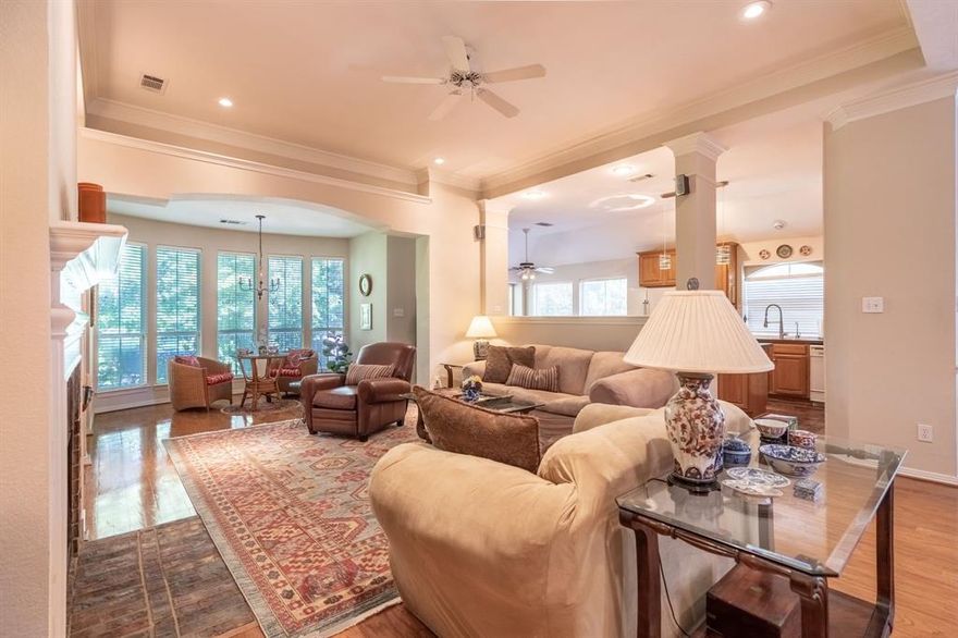 Charming tree house with a deck that overlooks a seasonal creek.  This home has so many wonderful architectural details. Large family room has wood floors, fireplace and lots of built ins and great formal dining area. Southern living kitchen offers brick floors and tons of storage. Opens to the family room with oversized serving bar. Huge master bedroom retreat overlooking the forest of trees. All bedrooms have walk in closets.Hard to find three car garage! Walk to the green belt and park just a few doors down. Bring your ideas and your own style to make this your next home in this gated community. Chandlers offers 24 hour security, pools, tennis, parks and marina.