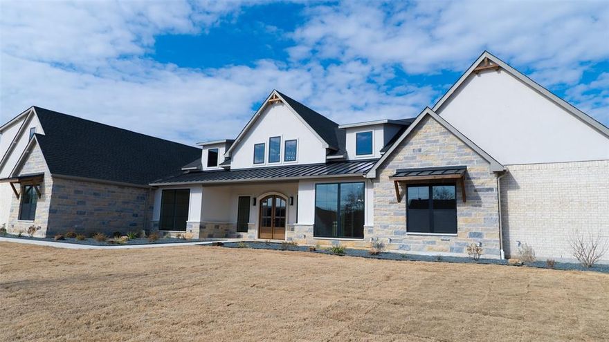 Welcome to your dream home — a stunning custom new build offering nearly 5,000 square feet of luxury living. Designed with elegance, functionality, and modern comfort in mind, this masterpiece features 4 spacious bedrooms, 4.5 designer bathrooms, and a 4-car garage, all crafted with meticulous attention to detail.
Step through the inviting foyer into the expansive open-concept living area, where a grand family room with soaring ceilings and abundant natural light flows seamlessly into a gourmet kitchen and dining space—perfect for both entertaining and everyday living. The kitchen is a chef’s delight, complete with custom cabinetry, premium countertops, a large island, and a walk-in pantry.
The luxurious primary suite offers a peaceful retreat, featuring a spa-inspired master bath with a soaking tub, dual vanities, and an oversized walk-in shower. Each additional bedroom includes private or en-suite bath access for ultimate comfort and privacy.
Work from home in the dedicated office, keep organized with a convenient mudroom and laundry room, and enjoy outdoor living year-round on the covered front and back porches — ideal for relaxing or hosting guests.
With high-end finishes throughout, ample storage, and thoughtful design in every detail, this home redefines modern Texas living.

Highlights:
• 4,955 Sq. Ft. of custom craftsmanship
• 5 Bedrooms  4.2 Baths 4-Car Garage
• Open-concept living with expansive natural light
• Designer kitchen with premium finishes and walk-in pantry
• Luxurious master suite with spa bath
• Dedicated office, mudroom, and laundry
• Covered front & back porches perfect for entertaining
• Located in Timber Wolf Valley, Tarrant County, TX