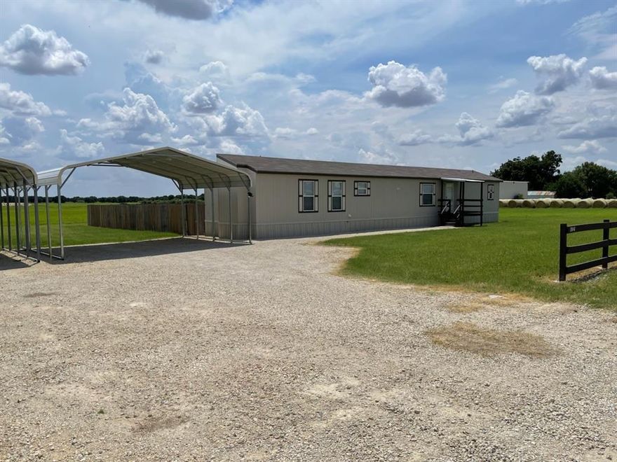 Beautiful & Immaculate 2021 Ranch-Style Home in Hawley!
This well-maintained 3-bedroom, 2-bath ranch-style mobile home offers 1,216 sq. ft. of comfortable living space on an approx. 0.38-acre lot, UP to 1acre lot if desired, with small price adjustment!!  Featuring an open floor plan, fresh paint, new flooring, and energy-efficient design, this home shines inside and out. The kitchen boasts all-black updated appliances, HIDDEN Extra large Laundry Room!  A breakfast bar, eat-in dining, and stunning stained ash cabinets.
Enjoy the outdoors with a covered deck, nicely fenced yard, and a spacious backyard—perfect for relaxing or entertaining. Additional highlights include a new HVAC system, double carport, and charming curb appeal. This property has been very well cared for—truly move-in ready!