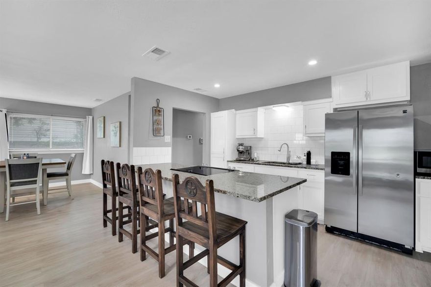 Welcome to this little gem that checks many boxes! The location is excellent- nestled in an established neighborhood yet also conveniently close to I-35 and I-20 for quick and easy access to all DFW has to offer! Several local highlights are especially near for endless fun and good times- downtown Dallas, the Bishop Arts, and Deep Ellum. The property itself is on over a quarter of an acre with a spacious backyard, large rear porch, and mature trees ready to be enjoyed. Inside the home you find an inviting open concept highlighted by many updates all throughout- large kitchen island, granite kitchen counters, luxury vinyl plank flooring, spacious living room and dining room space. Other recently redone features include interior paint, tile around shower, and bathroom tub.  The layout and the outdoor amenities make entertaining easy inside or out! Excellent storage shed in the back! This one can work well as your primary residence or as an investment property for one looking to add to their real estate portfolio! Come see today!