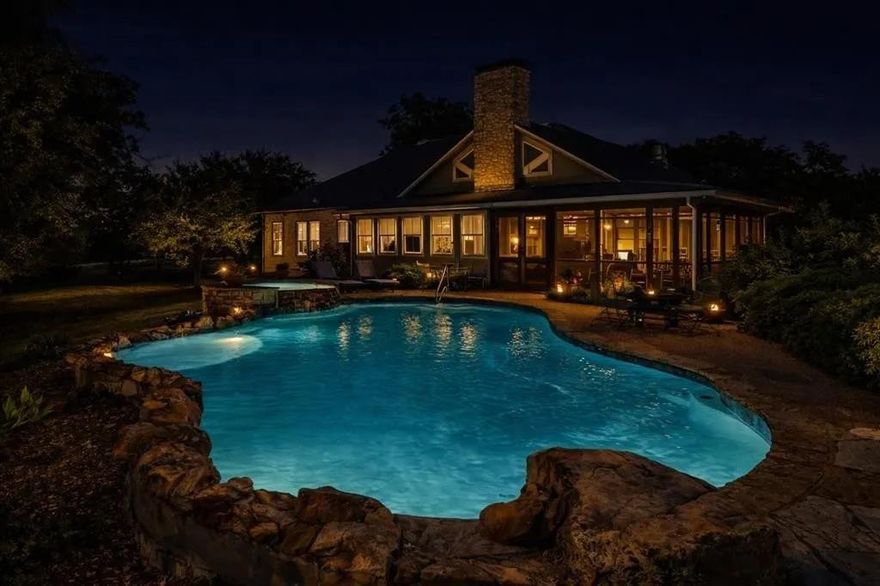 Welcome to Creekside Reserve, a rare blend of natural beauty, refined living, and wide-open freedom just northeast of Palmer. Set along the quiet bends of Grove Creek, this 159-acre ranch offers rolling pastures, mature pecans and oaks, shaded creek bottoms, and abundant wildlife including deer, turkey, herons, and seasonal monarch butterflies. The land feels alive, peaceful, and timeless.

At the heart of the property sits a thoughtfully curated 3-bedroom, 3-bath main residence blending character and modern comfort. Antique doors reclaimed from a historic NYC hotel set a warm, storied tone, while light-filled living spaces, a stone fireplace, and screened porches invite slow mornings and relaxed evenings. Just outside, a heated saltwater pool and hot tub elevate everyday living into something truly special.

Creekside Reserve also functions as a part-time B&B with minimal marketing, offering immediate income potential. The land is exceptionally well-equipped with mixed pasture and woods, creek frontage, three tanks, two historic hand-dug wells, working cattle pens, cross fencing, a former horse barn with loft, and productive coastal Bermuda hay fields. Whether for livestock, equestrian use, recreation, or quiet enjoyment, the possibilities are endless.

Two prepared build sites add flexibility—one with underground power, two water taps, a Generac backup system, privacy wall, additional pool, and 50-AMP RV hookups; the other perched on a rise with sweeping ranch views. Additional features include a gated entrance, whole-home generator, storm shelter accessible from the primary suite, propane tanks, and reliable utilities.

Conveniently located on FM 813 with easy access to nearby towns and highways, Creekside Reserve feels worlds away while remaining well connected. This is more than a property—it’s a place to gather, restore, and create a life defined by space, comfort, and possibility.