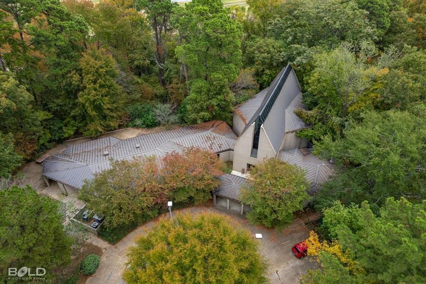 The subject property is improved with a house of worship containing 9,980 sf with associated site improvements on an irregularly shaped site of 7.72 acres.  Between the improvements and Bayou Pierre, the boundary on the east side of the property, the elevation declines from 190 to 160 ft. There is a 100 ft wide Caddo Parish Levee Board maintenance easement above the high bank of Bayou Pierre that restricts development in that area, but otherwise there are no easements or encroachments that would adversely effect any planned improvements.  Property frontage along Ellerbe Rd is 326 feet; parking, drives and walkway total nearly 48K square feet.  Residential and or low density commercial establishments such as those currently existing in proximity to the site are likely the highest and best use.  The sanctuary and vestibule comprise 4,275 sf with a 615 square ft balcony, classrooms and social hall total 4,100 square feet and administrative offices represent 990 square feet.  Separate restrooms exist in the classroom wing each with 7 fixtures as well as a private 3 piece restroom in the administrative offices.  Ceiling heights throughout the property vary from 9 to 48 feet under a hip and gable roof of prefinished metal panels with exterior brick veneer walls on a foundation of reinforced concrete perimeter and footings.  The site is approximately two miles from Highway 3132 with access to I-49  one exit northwest and Bert Kouns Industrial Loop one exit southeast providing ease of access throughout the region.  The Port of Shreveport-Bossier sits roughly seven miles southeast of the property.  The property is zoned R-E so permitted by right for the following uses--Bed and Breakfast, Bus Transfer Station, Cemetery, Community Center, Community Garden, Day Care Home, Single Family Dwelling, Primary or Secondary Educational Facility, Group Home, Place of Worship, Public Park. Consists of 3 parcels total--only one is highlighted on the map. Please contact LA for showings.