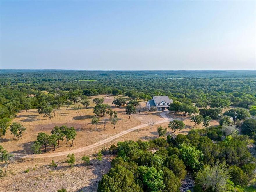 First ever offered on the public market, DBar6 Ranch offers a rare opportunity to own 1,000+ acres of vast topographical variety, live water & 100% of minerals less than 1 hour to FW. Spring-fed Robinson Creek meanders 2± miles through the center of the ranch creating fertile pastures w massive oak & pecan groves. The 210± feet of elevation offers expansive views & varied topo, vegetation & habitat for wildlife including whitetail deer, Rio Grande turkey & fish. Perched at a prime high point overlooking the entire ranch, the recently updated 4,400±SF house & pool are great for relaxing & entertaining. The barn offers storage & 2bed 1bath apartment. 3800± feet of Lipan Highway frontage allows quick, easy access to Granbury in less than 15mins & Weatherford in less than 30mins. Add't water includes 2 tanks (1 spring fed), mult seasonal creeks & 2 water wells. Explore the ranch w extensive road & trail system. Fully ag-exempt & fenced. NO ACTIVE PRODUCTION OR PAD SITES!