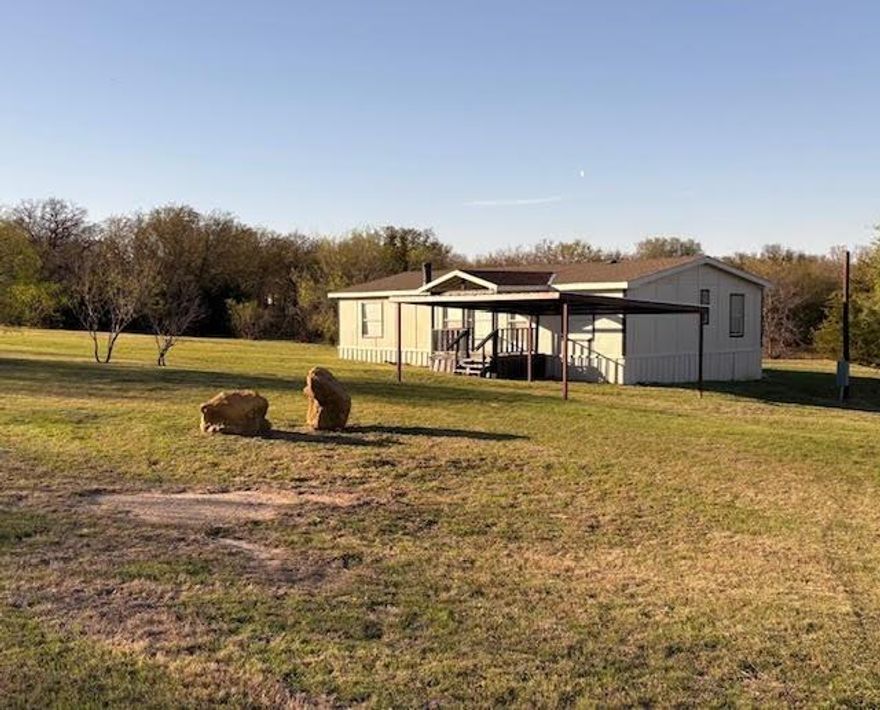 Double wide with 3.5 acres...This would make great little HORSE property it has some fencing but will need more. 3 bedrooms 2 baths 2 car carport....This home has had lots of remodeling done, including walk in showers, new paint, new flooring, also nice covered front porch.  Property can also be divided and sold with 1.75 acres $219,000 if needed.... MUST BE CASH, CONV or POSSIBLE OWNER CARRY...Very private call Gilda for a showing.  Inside pics coming soon or go take a look anytime.