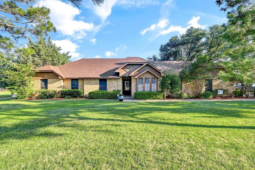 Discover the perfect blend of comfort, character, and outdoor living in this updated 4bedroom, 2.5-bath home nestled on a large picturesque, maturely treed lot. Elegant flooring throughout the main living areas, adding warmth and rustic charm. The spacious kitchen is a chef’s delight and includes a breakfast area that leads into the den and dedicated cocktail bar. A separate dining room can easily be converted to a home office, if desired. The primary retreat boasts a spa-like en-suite with a over-sized garden tub with built-in shower and dedicated closet area. The showstopper of the backyard, spacious, open-air covered patio making this the ultimate venue for outdoor parties and gatherings and the renovated diving pool has new ceramic tile and plaster. The over-sized garage has new epoxy floors along with the expansive patio area. Other exterior structures include a large 20 x 20 dedicated workshop, a utility shed that houses pool equipment, and a pool house with loft area that can be used as a craft room, office or other hobbies. Other recent renovations include a newly installed roof, new carpet and baseboards in the living areas and bedrooms and also new paint. With its tranquil setting, upgraded features, and versatile spaces, this property is a rare find!