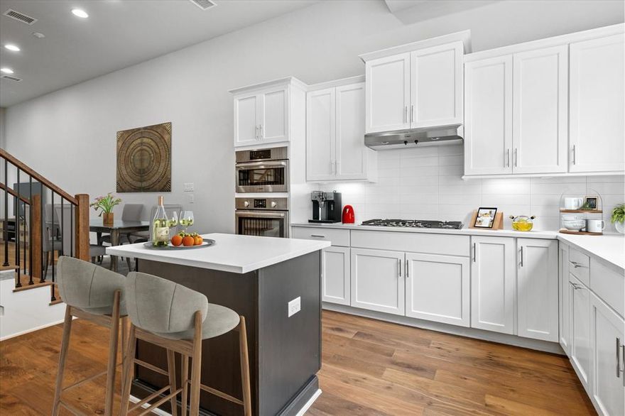 The perfect move-in ready luxury 3-story, 2BR, 2.5 bath townhome for anyone wanting closeness to the heart of your City. Located in a secluded part of the property, tucked in nicely with the trees, w a peaceful vibe of a relaxing nat. area in the woods.   Highly sought after Private Gated Community with a COMMUNITY POOL! The Margaret Hunt bridge is your own quick access route to the heart of downtown, a few minutes more and move right into the exciting Uptown and Oak Lawn areas. Minutes to eclectic Bishop Arts District. Open fp features soaring 12ft ceilings, Bosch appliances, large windows, gourmet kitchen, 2 car tandem style garage! Each bedroom includes its own WIC & full bath. Gourmet kitchen, stainless steel BOSCH appliances, quartz countertops, and custom soft-close cabinetry and drawers, with under cabinet lighting. Open & bright living with plenty of room to entertain! COME SEE, FEEL the VIBE and BE HOME! LOW $145 per month HOA.