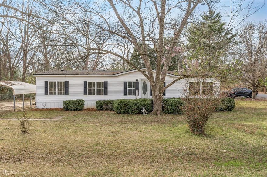 Immaculately remodeled home just 3 minutes from the boat launch on Caddo Lake! This stunning property is one to see - with a large corner lot, 2 carports, and 2 decks, there is room to spare for all your outdoor activities. Inside, the home features tons of character thanks to all the attention to details, from the wood beam accents to the gorgeous fixtures. The wide-open floorplan is perfect for hosting gatherings, with the spacious living room boasting a vaulted ceiling, cozy brick fireplace, and flowing seamlessly into the dining area. The updated kitchen features brand new stainless appliances, a center island, and plenty of cabinet space to make meal prep a breeze. Offering the perfect spot to relax, the large primary suite is complete with a spa-like ensuite bath and HUGE walk-in closet. The additional two bedrooms share a modern full bath, giving privacy and convenience to guests and family. Plus, a brand-new roof will bring you peace of mind. With all of these great amenities, this property is sure to impress, so don't wait and schedule your tour today!