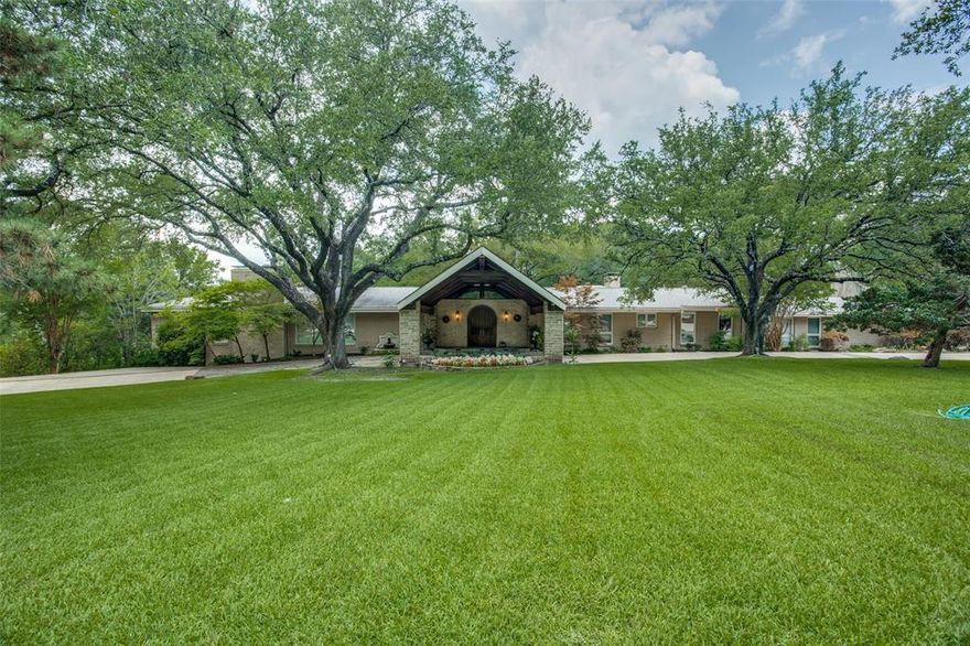 Oasis in the city! You won't believe you are in the heart of Dallas when you see this spectacular property offering 2.096 acres, lake, dock, pool, and studio-guest quarters, as well as 4900+ sq ft home with 2000 bottle wine rm & 3 car gar.Circular drive w porte-cochere welcomes you as you enter to see all amenities offered.Main home has 4 BR, 4.1 BA, library, office, fml DR, 2 LA, brkfst rm, game rm. & screened-in porch.Split flr plan w Mstr BR in its own wing for privacy. Huge windows show stunning views of BY with decks, outdoor cooking area,mature trees, fountains and lake. Guest house has BA, kitchenette & 2 covered parking.Wonderful property for outdoor entertaining or a serene retreat from busy city life!