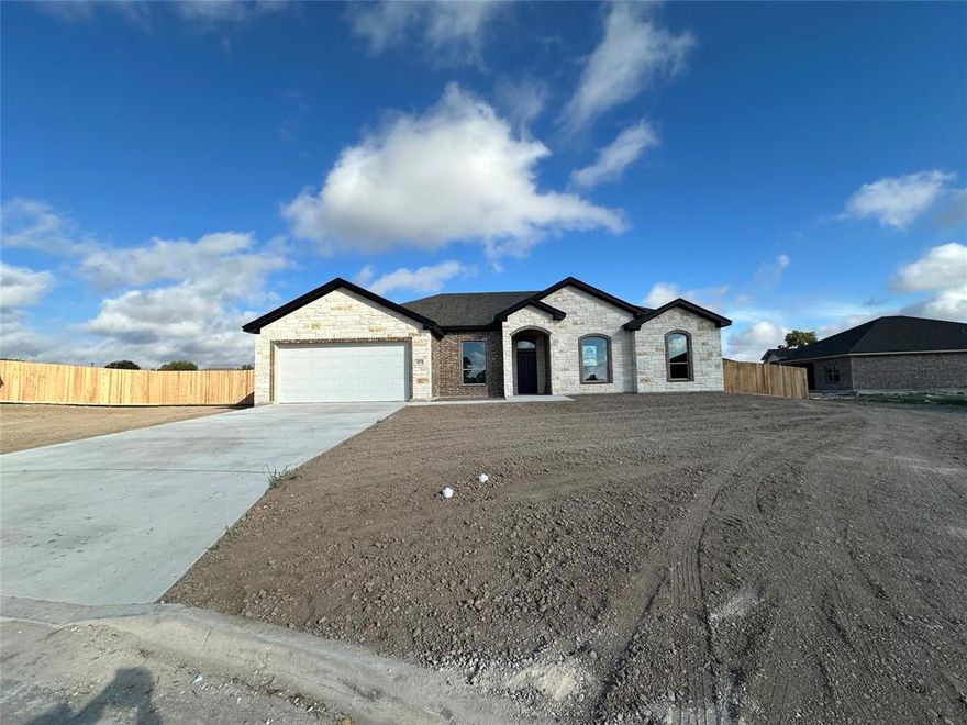 Discover the Nixon plan, a 2,279-square-foot home that blends timeless charm with modern comfort, built by Carothers Executive Homes, consistently awarded for exceptional quality and attention to detail. This thoughtfully designed residence features 3 spacious bedrooms, 2 bathrooms, a private study with French doors, and both formal and informal dining areas, offering flexible spaces for everyday living and entertaining.

The formal dining room sets the tone for elegant gatherings, while the open-concept living area is highlighted by accent ceiling beams and a stylish electric fireplace, perfect for cozy ambiance and year-round enjoyment.

Designed with energy efficiency in mind, this home includes spray foam insulation, helping maintain comfortable indoor temperatures and reducing utility costs throughout the seasons.

Step outside to a generously sized back patio, ideal for relaxing, entertaining, or enjoying peaceful mornings in your own outdoor haven.

Located in the popular Lorena ISD, this home is part of the Rosenthal Estates community—conveniently situated just south of Waco with easy access to I-35, making commuting and weekend getaways a breeze.