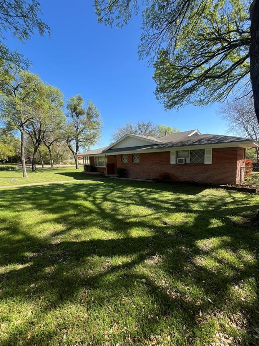 Charming vintage home with endless potential! This well-loved 3 bedroom, 2 bath property, built in 1958 and owned by only two owners, sits on a large corner lot filled with beautiful, established flowers and landscaping.

Inside, you’ll find two spacious living areas, perfect for entertaining or relaxing. The cozy den features a stunning wall-to-wall brick fireplace that is wood-burning with gas starter, adding warmth and character. A pocket door provides separation and privacy to the den area when desired. This home offers a great blend of classic charm and important updates, including a water heater and furnace replaced approximately 3 years ago and all underground plumbing replaced just 2 years ago. While the home does need some updating, it still showcases unique vintage touches that add personality and timeless appeal. Additional features include a two-car garage, with one side converted to a workshop space, making it perfect for hobbies or extra storage.

If you’re looking for a solid home with character, space, and the opportunity to make it your own, this is a must-see!