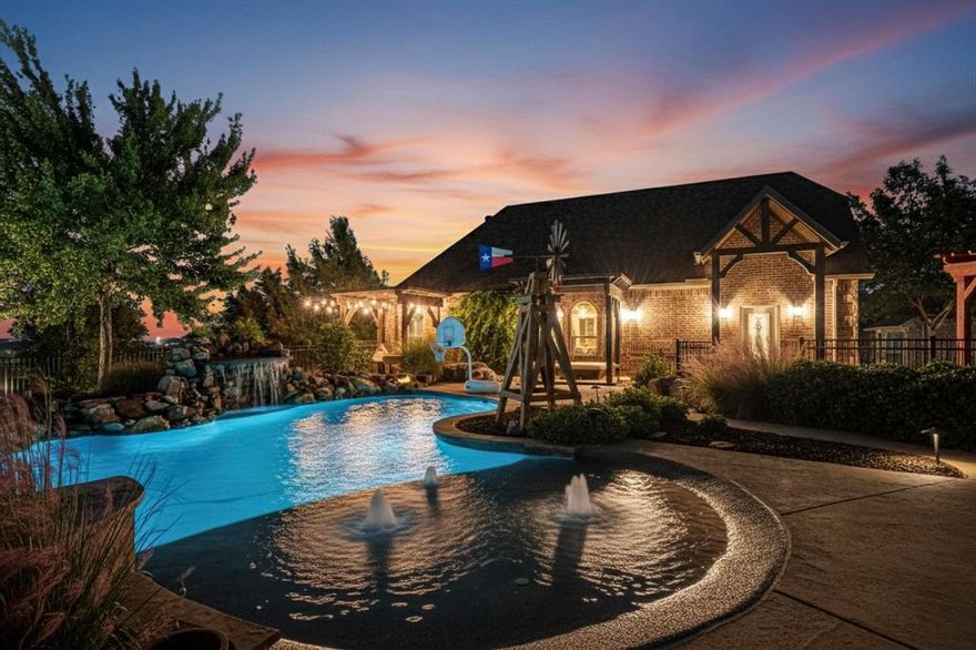 Resort-style living at its finest! This stunning 4-bedroom, 3-bath home offers an office, dining room, living area, and game room—all designed with comfort and luxury in mind. Step outside to a backyard paradise built for entertaining, featuring a sparkling pool with waterfall, grotto, spa, and propane fire pit surrounded by decorative concrete, lush landscaping, and low-maintenance turf.

The outdoor cabana kitchen includes a built-in grill, drawers, refrigerator, sink, granite counters, a spacious island, and a cozy fireplace—perfect for gatherings year-round. Additional amenities include a sport court, 4-hole putting green, garden center, in-ground trampoline, windmill, pergolas and a wooden arbor swing.

The 22 x 48 heated and cooled detached shop with a Versa-Lift attic elevator provides tons of storage and workspace. Inside the home, enjoy rich cabinetry, extensive molding, hardwood and wood-look tile floors, built-ins in the master closet, and a custom desk and shelving near the game room. The attached 3 car garage offers built-in cabinetry, storage racks, insulated garage doors and painted floor. The property is enclosed with iron fencing and a private gate for added security. New roof, gutters, and insulated garage doors. 

Luxury, function, and endless entertainment—this home truly has it all!