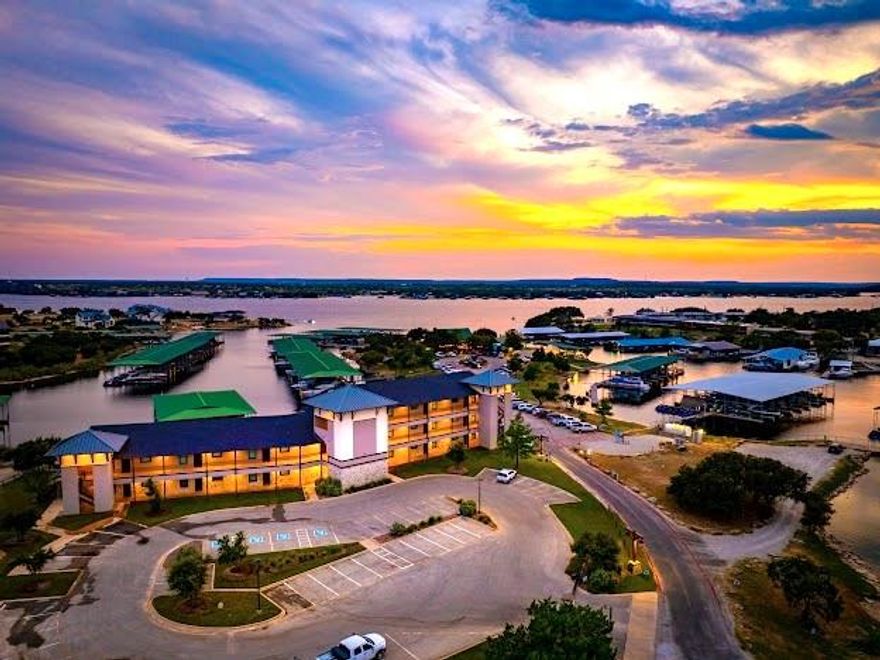 STUNNING FURNISHED, TURN KEY, HARBORVIEW WATERFRONT CONDO with Excellent Overnight Rental History, on Breathtaking Possum Kingdom Lake. Looking for the BEST in Care Free Condo Living at PK? Then this Gorgeous Condo is it, with a Lakeside Pool and Hot Tub, Fitness Center, Spa, Fire Pit, Outdoor Grilling Pavilion, and Panoramic Lake Views over the Marina, and Walking Distance to everyone's favorite waterfront, Restaurant Hemingways. This Ideal Location on the Peninsula is also close to all the Lake Amenities, and Hiking and Biking Trials nearby. This Condo is on the 2nd Level with Exceptional, Elevated Lake Views from Expansive Windows and has the Perfect Open Concept, Light and Bright Living Design, making it the Perfect place to Entertain all your Family and Friends, and Offset expenses with VRBO & Airbnb Rentals as well. So whether you are looking for a Resort, Getaway Condo or an Investment Property, or both, this PK Lake Condo has it all. Find out what PK Paradise is all about.......