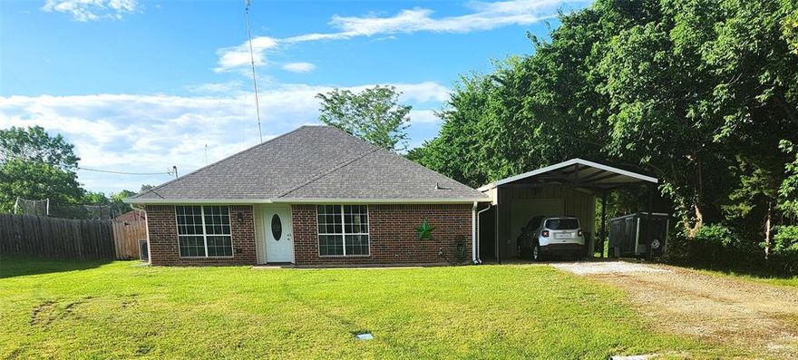 Beautifully maintained 3 bedroom, brick home in North Lamar school district.  This lovely home sits on half an acre with a large fenced back yard, welcoming, covered back porch and small shop.  This home is cozy and clean with an open concept living room, dining area.  Primary bedroom has a full bath attached as well as a spacious walk in closet.  Both secondary bedrooms have small walk in closets as well.  There are loads of large windows to let the light in. Roof and HVAC were new in 2023 and much of the wiring has been updated as well.  There is an EV charging station and RV plug in.  If the power goes out there is even a generator inlet. A more complete list of updates is available in the Assoc. docs. This home has been loved and needs to be seen to be appreciated.