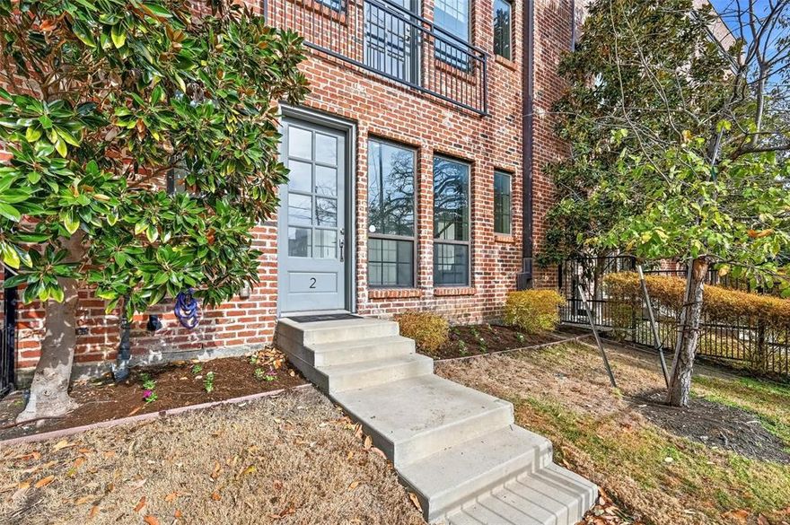 Contemporary 2-bedroom, 2.5-bath townhome with a private rooftop patio offering views of Downtown Dallas. Located within a short distance to restaurants and nightlife, this home also features an attached 2-car garage and a gated front yard—perfect for pets. The open-concept living space is bright and inviting with walls of windows, roller shades, hardwood floors, and stylish finishes throughout. The kitchen boasts abundant cabinet and counter space, a gorgeous backsplash, stylish pendant lighting, and a large island with a built-in butcher block table. A convenient half bath is located on the main living level. Upstairs, the spacious primary suite includes a walk-in closet and a beautifully tiled ensuite bath, along with a secondary bedroom with ensuite full bath, and upstairs laundry with room for a full-size washer and dryer. Entry level includes a utility or coat closet and access to the attached 2-car garage. Condo structured HOA covers landscaping and exterior maintenance.