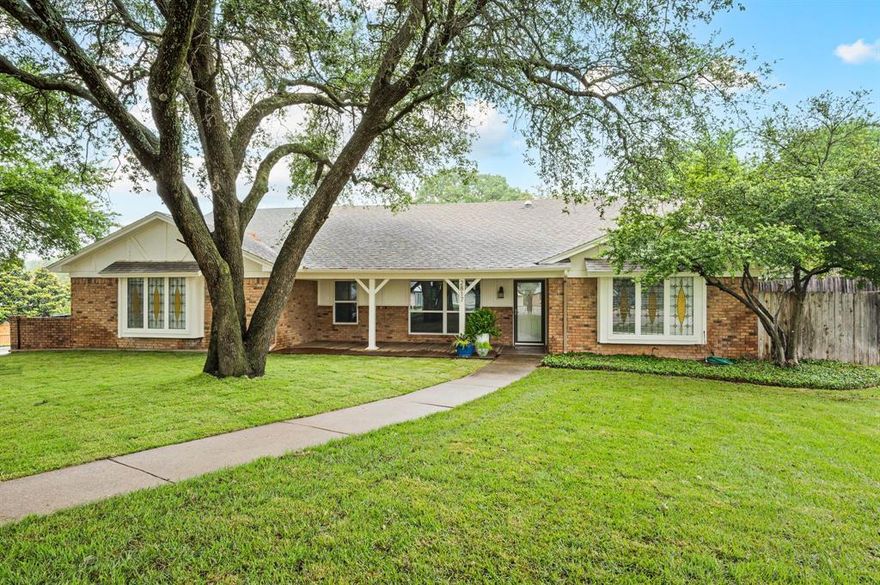 Watch the Boys Ranch Fireworks from Your Own Driveway. Fully Renovated 4 Bedroom, 2 Bath with a 18x24 Insulated Workshop with electrical, tucked away on a quiet, oversized cul-de-sac lot in the heart of Bedford. From the moment you step inside, the vaulted ceiling, open floor plan and abundance of natural light makes this home feel warm and inviting. Neutral Paint, Ceramic Wood-look tile flows through the main living areas with new carpet in all four bedrooms. The kitchen has been beautifully updated with crisp white cabinetry and a large functional bar overhang perfect for casual seating or game day entertaining. Opens seamlessly to the living spaces, creating an ideal setup for hosting and everyday living. The family room is complete with the a cozy wood-burning fireplace that adds just the right touch of charm. Oversized second living area, features a wall of windows overlooking the pool and gorgeous backyard. This bonus space could be used as a home office, playroom for the kiddos, sunroom or so much more. The split-bedroom layout provides additional privacy for family or guests. Both bathrooms have been fully renovated with stunning tile work, updated fixtures, modern lighting, mirrors and ample storage. The spacious primary suite features an ensuite bathroom with a gorgeous oversized shower, new fixtures and 4 inch mitered edge vanity top. Step outside to your own quiet, private retreat. A large mature oak tree creates a peaceful, Hill Country feeling. Wide open spaces, diving pool with custom cover, whole house water filtration system, expansive yard and second water meter for the sprinkler system. This one of a kind home offer endless possibilities for relaxation, hobbies or additional storage. All of this in a prime location close to DFW International Airport, major freeways, hospitals, shopping and dining. *HEB ISD is growing and building 2 New High Schools, Replacing LD Bell and Trinity and also 4 brand new elementary schools.