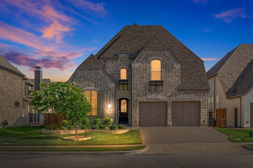 More than a house—this home offers a lifestyle, located in the coveted lakefront community of Westbury at Tribute in The Colony, brimming with resort-style amenities, access to the marina and kayak launch, and walking distance to Prestwick Elementary! The home itself is a showpiece, featuring smart home technology, 19-foot ceilings, first floor mother-in-law or guest space, custom designed game room and theater room, just to name a few. The dedicated office showcases a designer linear chandelier serving as a bold centerpiece for the workspace. Whether you're hosting family gatherings or enjoying a quiet evening at home, the expansive living room delivers comfort and style with a stone gas fireplace easily ignited with the touch of a wall switch. The open floor plan flows seamlessly to the gourmet kitchen, beautifully designed for both cooking and entertaining, offering white cabinetry that pairs perfectly with bold, luxurious quartz countertops, and a substantial eat-in island. The luxurious primary suite is a true retreat, with vaulted ceilings, dramatic bay windows, and a spa-inspired en suite bathroom. The custom-designed second-floor game room or man cave is where elevated design meets laid-back fun, including a built-in dart board, ceiling beams, and a centerpiece light fixture to suspend over a gaming table. Immerse yourself in the ultimate cinematic experience in the theater room, upgraded with theater-style columns, sconce lighting, and in-ceiling surround sound speakers. Upstairs you will also find 2 additional bedrooms, 2 full bathrooms, plus a bonus room that could easily be restored as a 5th bedroom. Residents of Westbury not only enjoy exclusive access to the community pool, park, and pickleball courts, but they are also granted access to the marina, scenic nature path along the lake’s edge, kayak launch, and a nature preserve showcasing breathtaking sunset views over the water, making every day feel like a vacation.