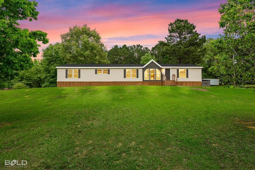 Welcome to your private retreat on 3.9 acres! This beautifully updated double-wide home combines modern style with peaceful country living. A charming porch sets the tone, perfect for relaxing and enjoying the surrounding views.Inside, you’ll find a spacious open floor plan designed for both comfort and functionality. The home features fresh updates throughout, including brand-new flooring, fresh paint, stylish fixtures, and eye-catching black and oak accents that create a warm, contemporary feel. The kitchen is a standout with butcher block countertops, a new aesthetic backsplash, and recessed lighting that adds a sleek, modern touch.This home offers four generously sized bedrooms and two full bathrooms. The primary suite is a true escape, featuring a freestanding soaking tub, double vanity, and a walk-in shower. Cozy carpeted bedrooms provide comfort, while barn-style doors and a fireplace add character and charm.Step outside to enjoy the fenced backyard—ideal for exploring and entertaining—along with a gravel driveway and a convenient on-site storage building.

If you’re looking for space, style, and modern updates all in one, this property delivers the perfect blend of comfort and country living.
