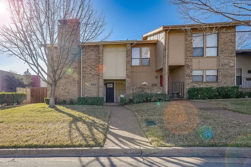 MOVE  IN READY!! Gorgeous updated townhome in the highly desirable Oak Shadow Townhome community in HEB ISD! This home has new windows through out, new gorgeous oak colored plank flooring, fresh paint, and updated light fixtures! The first floor of the town home has a large living room with accented mirrored wall, wood burning fireplace and French doors that lead to a new decked patio. The eat-in kitchen has new stainless refrigerator and dishwasher, new countertops, lighting fixtures, pantry and updated half bath. The laundry room is off the kitchen and includes a washer and dryer. On the second floor are two large bedrooms with updated tiled shower, countertops and oversized vanity. The primary suite has a mirrored accent wall, plenty of windows for light, an en suite bathroom with new walk-in shower, vanity and walk in closet. The backyard has new fencing, decked patio and courtyard nestled between the residence and two car detached garage with rear entry. The HOA includes community pool, front lawn maintenance and exterior painting.