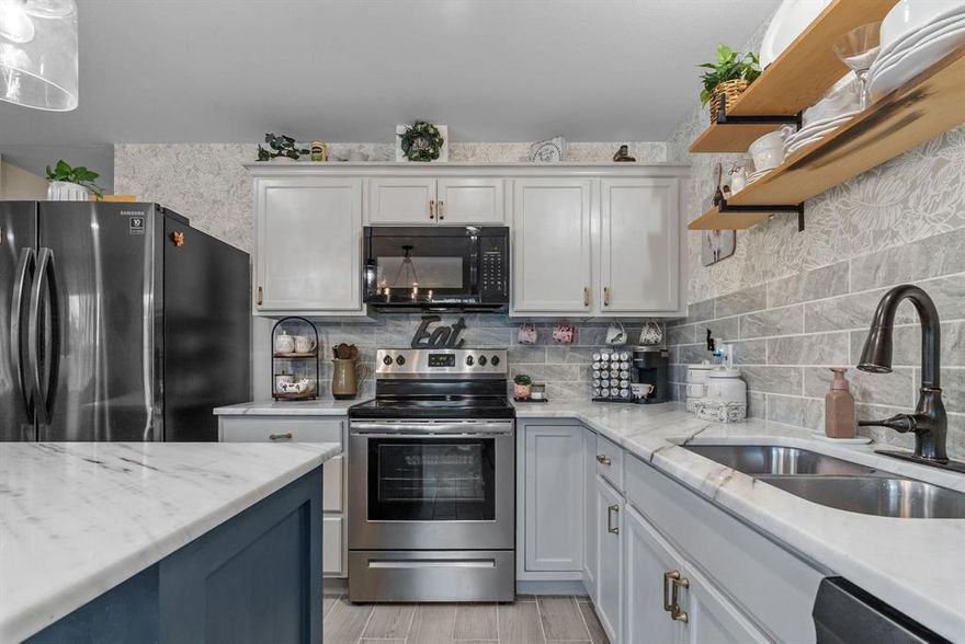 Built in 2022, this thoughtfully designed 3-bedroom, 1.5-bath home blends modern finishes with cozy, intentional details that truly make it feel like home. The charming stone exterior and inviting front porch set the tone, while a concrete driveway for two vehicles plus a two-car carport adds everyday convenience. Step inside to discover a beautifully designed interior with quartz countertops, painted cabinets, modern lighting, a large kitchen island, and floating shelves that elevate everyday living. The stone fireplace creates a warm focal point, while carefully chosen finishes — like wallpaper accents — bring character to every corner. Outdoor living shines here: enjoy a shaded gravel seating area, a firepit with ambient lighting, a spacious backyard perfect for play or pets, and a storage shed for tools or toys — all thoughtfully arranged for relaxed gatherings under the Texas sky. This home is tucked in the Comanche Cove neighborhood which offers a community pool and clubhouse. The location is convenient, about 4 miles (8–10 minutes) to Historic Downtown Granbury’s shops, eateries, and events; approximately 10 minutes to the schools; and approximately 2.6 miles (6 minutes) to Lake Granbury Marina, your gateway to boating, lakeside dining, and waterfront fun.

Come make this cozy home yours today!