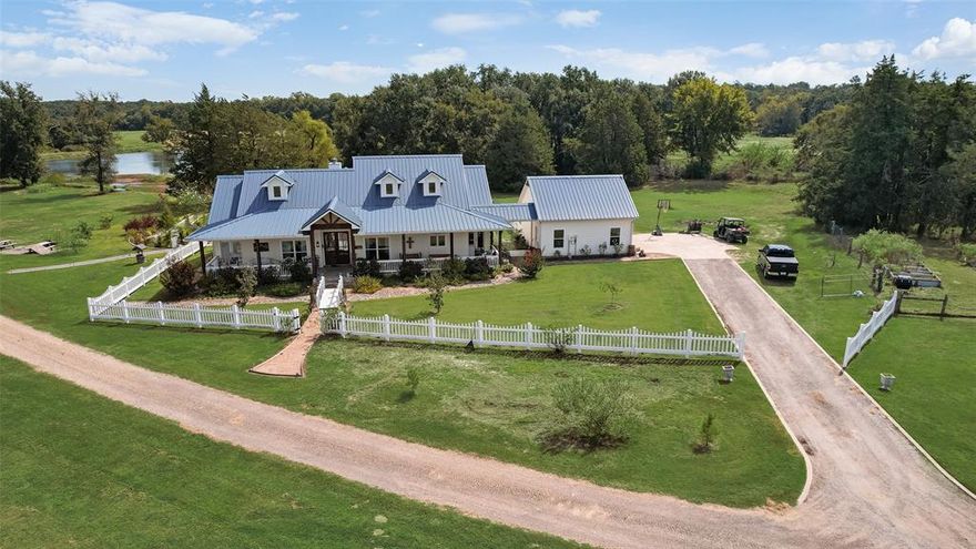 Rockin B Farm 35 miles to Dallas sits on luxurious 77 acres offering 2 Modern Farm Homes built in 2020 of serene country living. This stunning gated property offers rolling hills, peaceful nature and beautiful sunsets, 4 ponds, lush pastures for livestock grazing with Metal Barn and Shed-Shop on concrete slab. Cross over bridge to enter first home of 2,439 sf with 3 bedrooms 2 baths, Wrap around porches, open floor plan for entertaining, high end appliances, soft close drawers, screen door pantry, pot fillers and large island with beautiful granite that flows through out with wood floors overlook family rooms. Wood ceiling and mantles in family room and patio hand picked tree from Oklahoma. Secluded Master suite with outside entry doors. Huge laundry room with cabinets, sink and MUD area to outside. Second home of 3,538 sf has 4 bedrooms 3.5 baths with wrap around porch and sitting area on front porch. Enter through Iron glass doors to stained concrete floors, open floor plan with gorgeous granite throughout home. Beautiful wood cabinets and massive island in kitchen. Master suite has door that leads to patio. Master bath adjoins laundry room with concrete counters, cabinets and storage closet. Above garage with staircase leads to Man Cave-Bonus room with own bath.  Large family room with Stone fireplace leads through French doors to outside entertaining with massive patio and pool. Gorgeous flowers gardens with walkways to pond. So much detail see Feature Sheet in Transaction Desk. Please only show qualified buyers with pre-approval.  Information deemed reliable. but Buyers & Buyers Agent are responsible for verifying all information.