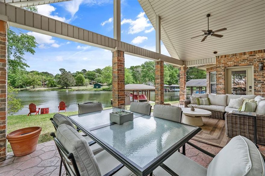 Beautiful home on the middle lake in Hide A Way Lake on level lot with primary suite on the main level. This 3 bedroom builders home boasts an open concept with all the details from custom molding to floor plugs to upgraded lighting fixtures.You're sure to love the wall of windows overlooking the lake, the vaulted ceilings & Austin stone fireplace in this impressive living room. The kitchen is truly the heart of this home with a matching stone breakfast bar, large dining space, center island, double ovens & tons of counter space. Located just off the living area, the primary suite features a sitting area, walk in closet& ensuite bath with jetted tub, dual vanities & walk in shower. Upstairs you will find 2 guest rooms with ensuite baths & a landing area large enough for a reading nook or office space. Step outside & enjoy the large vaulted patio with fans, stamped concrete floor, recessed lighting & an extended grill space. Follow the gentle path down to the boat dock with storage closet& lounging deck. Even the garage in this home has perks with 3 entry doors & motion sensing lighting. Solidly built home many subtle features to discover. Lush, low maintenance landscaping, & level lot are just a few of the bonuses of this location on the southern end of the middle lake with ample parking, close access to front gate, golf course, club houses & a prime viewing spot for fireworks on the 4th of July. Come see for yourself all that Hide A Way Lake has to offer; 27 holes of golf, 3lakes, pools, parks, 24 hr gated security, dining & more.