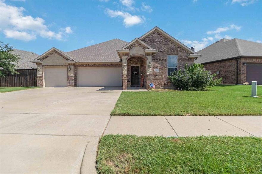 Located in the desirable Shannon Creek community of Burleson, this well-maintained single-story home offers a spacious and functional layout with extensive hardwood flooring throughout. The open living area features a cozy fireplace and flows into the kitchen and breakfast area, which includes a large dining space and a breakfast bar for additional seating. The kitchen is equipped with stainless steel GE Profile appliances, granite countertops, custom stained cabinetry, and a stylish tile backsplash. Enjoy the outdoors under the extended covered patio with a cedar gazebo—wired and ready for a hot tub. The 3-car, climate-controlled garage provides ample parking and storage options. A private study at the front of the home offers flexibility and can also be used as a fourth bedroom. The primary suite features a luxurious walk-in shower with multiple shower heads, creating a relaxing retreat.