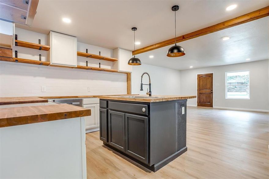 Cute remodeled 3 bedroom, 2 bathroom home in desirable GodleyISD! As you walk into the large living area you will notice the open concept to the kitchen. Beautifully updated kitchen features butcher block counters, wood shelving with black accent and an island that won't disappoint. Master bedroom includes bathroom with updated tiled standing shower. Good sized rooms. You don't want to miss out on this one! Call to schedule your showing today!